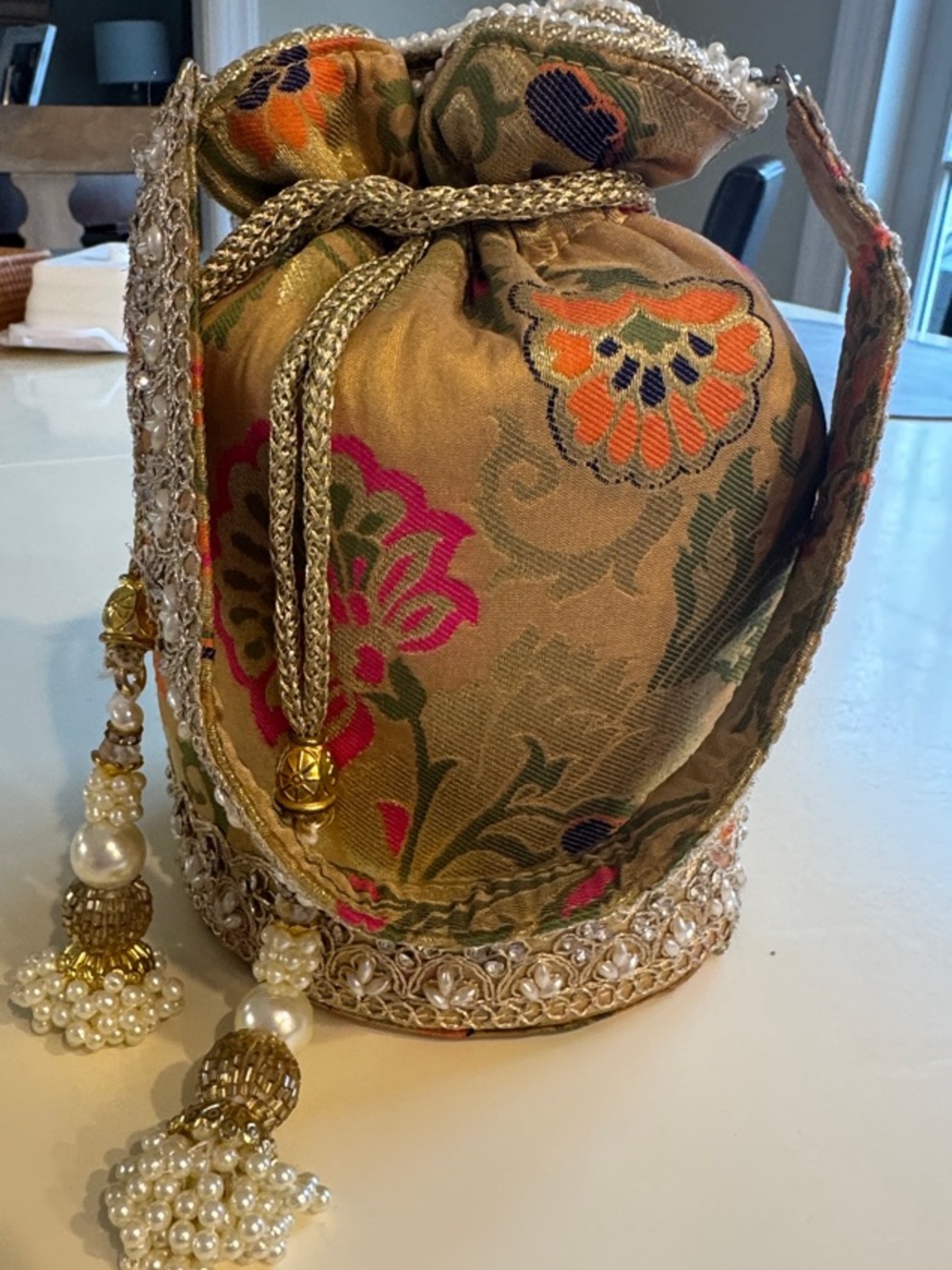 Embroidered Floral Drawstring Potli Bag in Gold